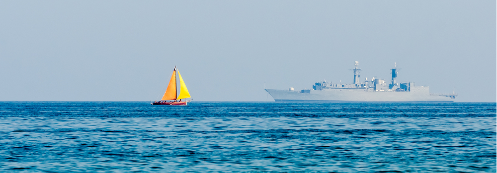 sailboat and tanker